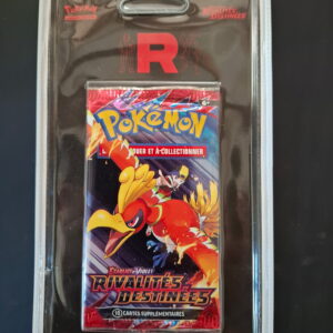 Sealed Pokémon trading card booster pack in a clear display case, showing a large red 'R' and colorful Pokémon artwork on the front.