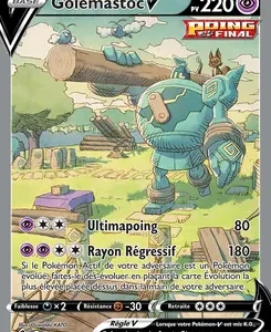 Pokémon trading card for Golemastov V with 220 HP; artwork shows a teal armored golem in a sunny, grassy landscape. Attacks listed include 80-damage and 180-damage moves.