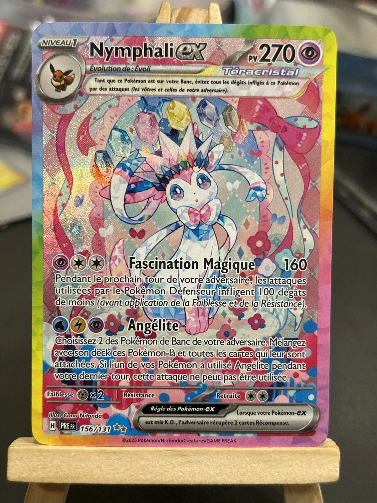 sl1600 2 JM Cards Nymphali EX Pokémon card with 270 HP showing a pastel holographic Sylveon and rainbow background attacks include Fascination Magique and Angélite